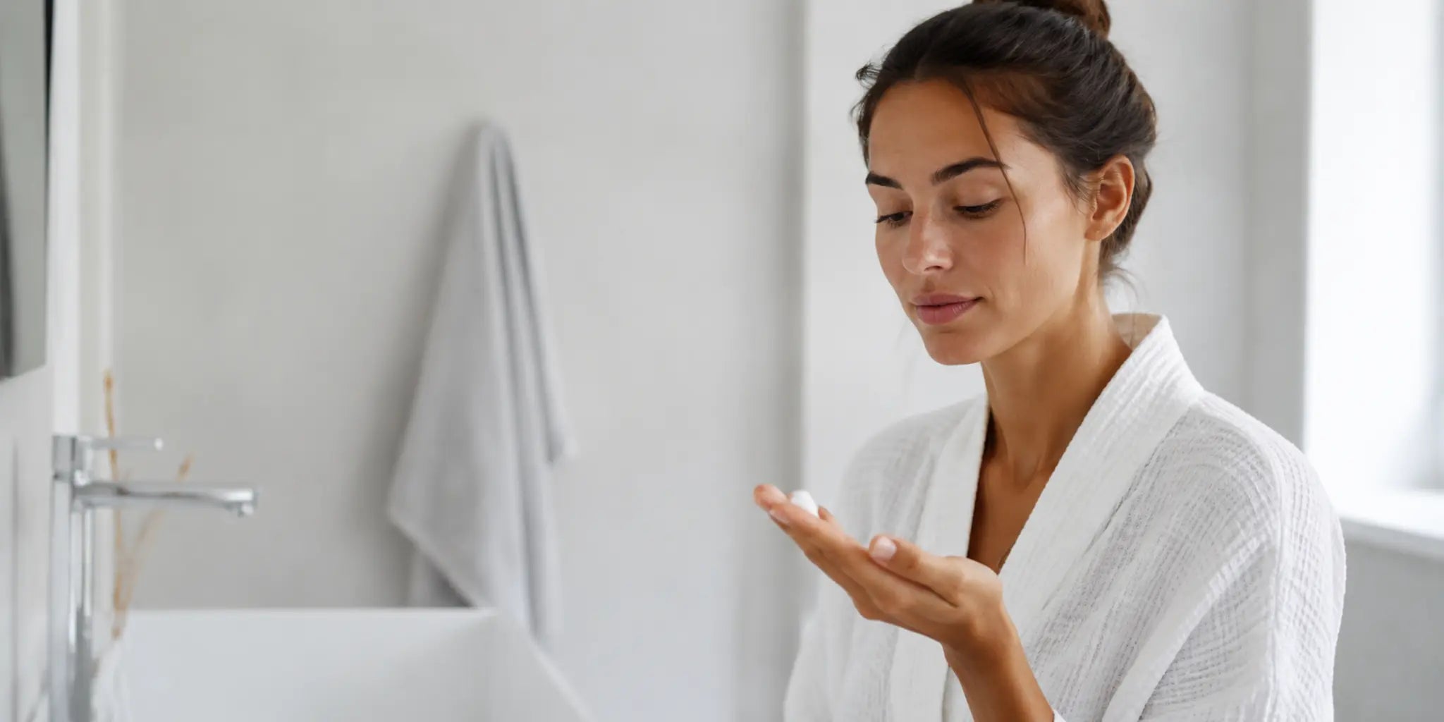 Woman checking a small amount of face cleanser before washing