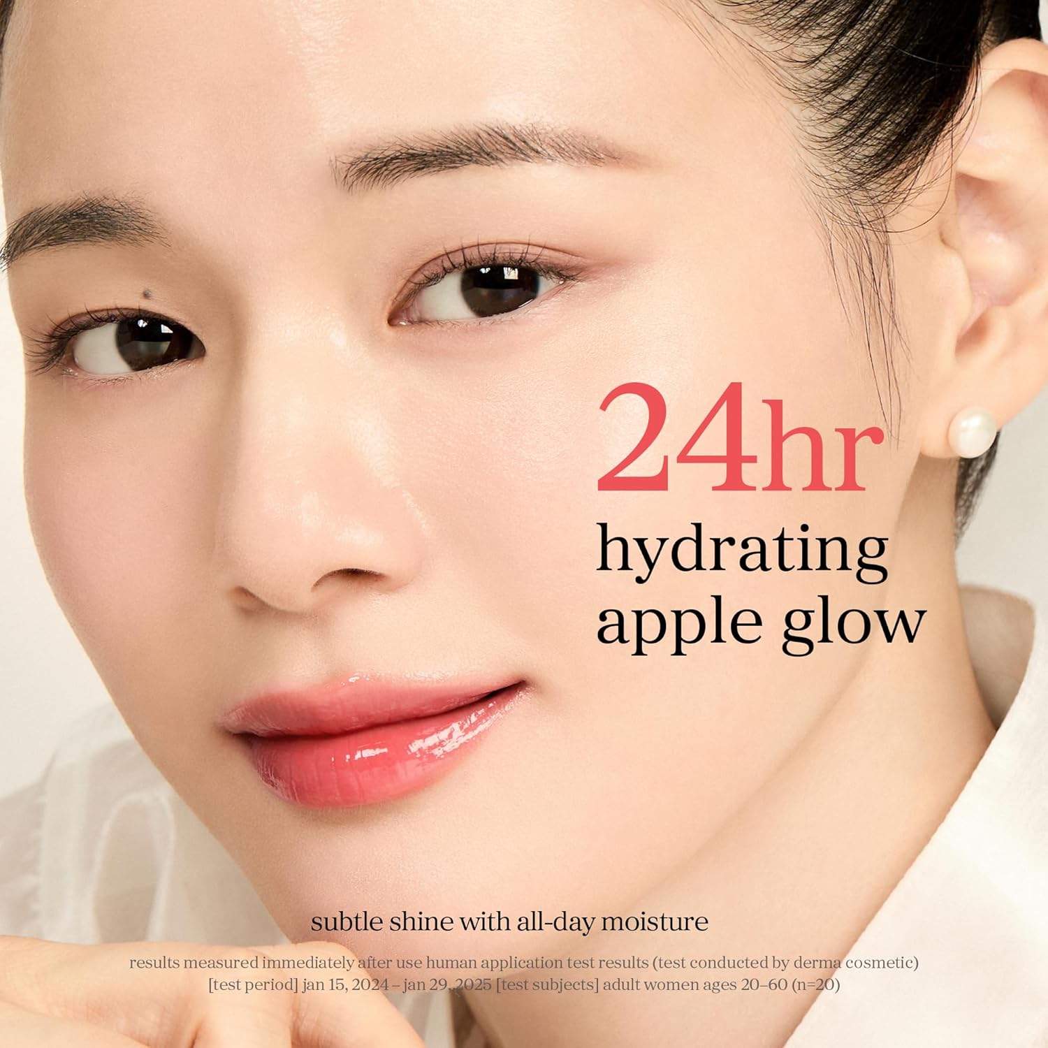 Appleberry lip oil on lips highlighting 24 hour hydration and glossy apple glow finish.