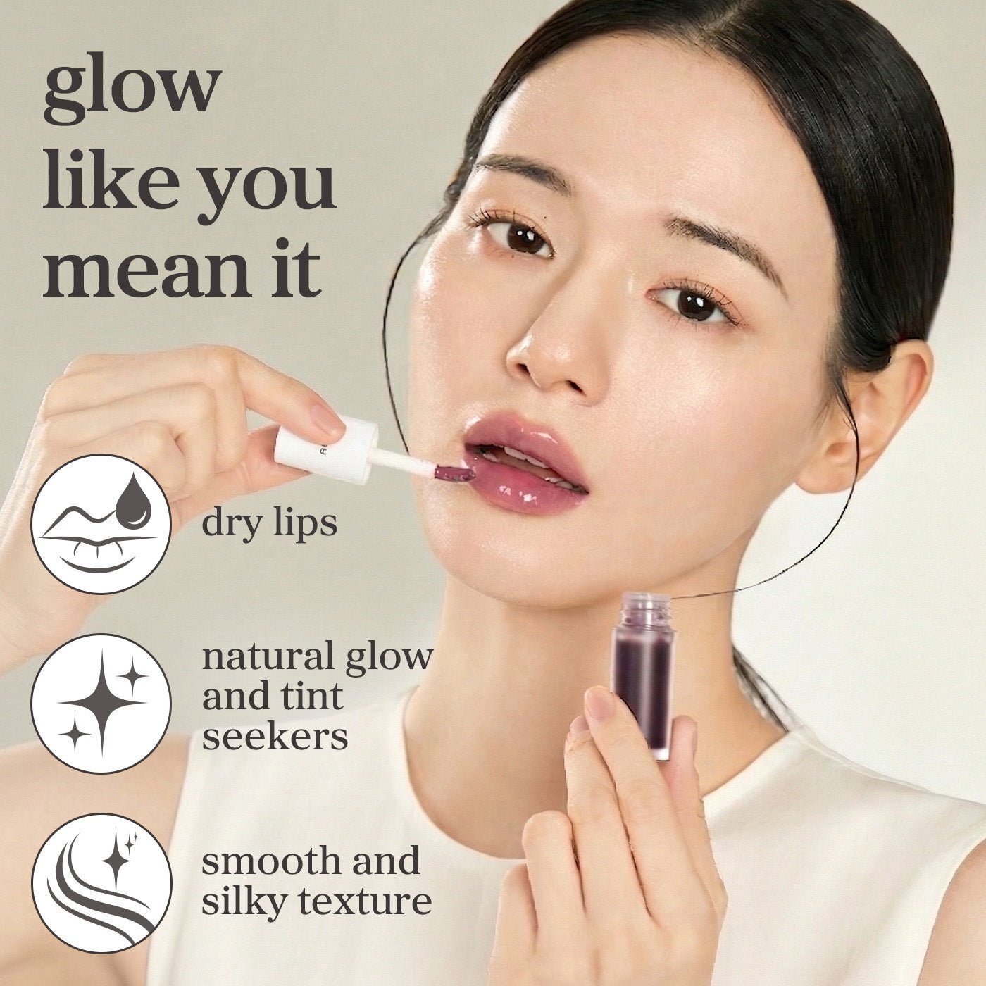 Appleblacktea lip oil applied on lips showing natural glow, smooth texture, and tinted finish.