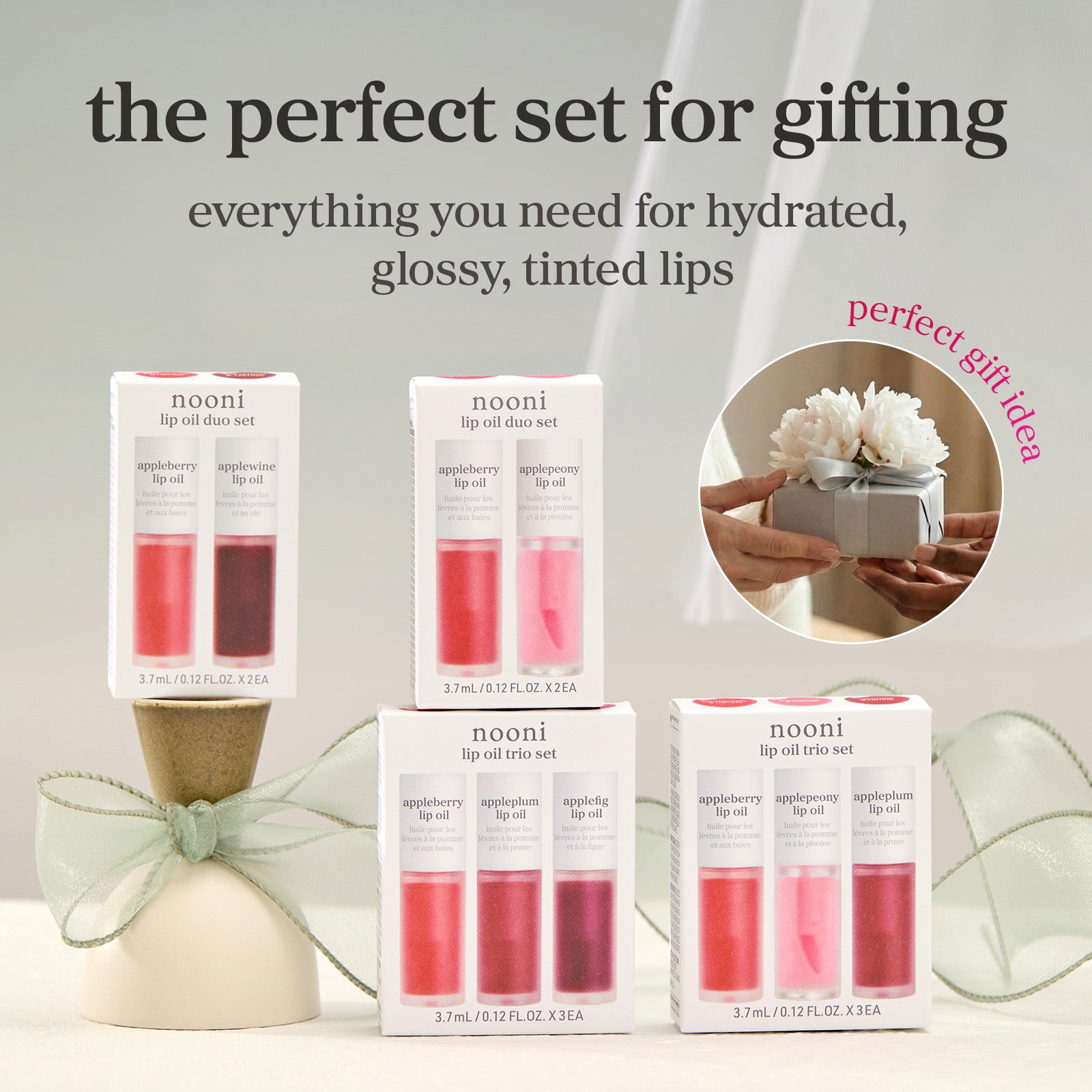nooni Lip oil gift sets with boxed products featuring glossy tinted lip oil collections.