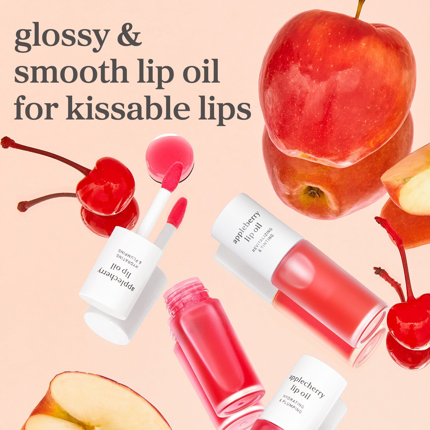 Appleberry and applecherry lip oils with fruit elements showing glossy tinted shades and smooth finish.