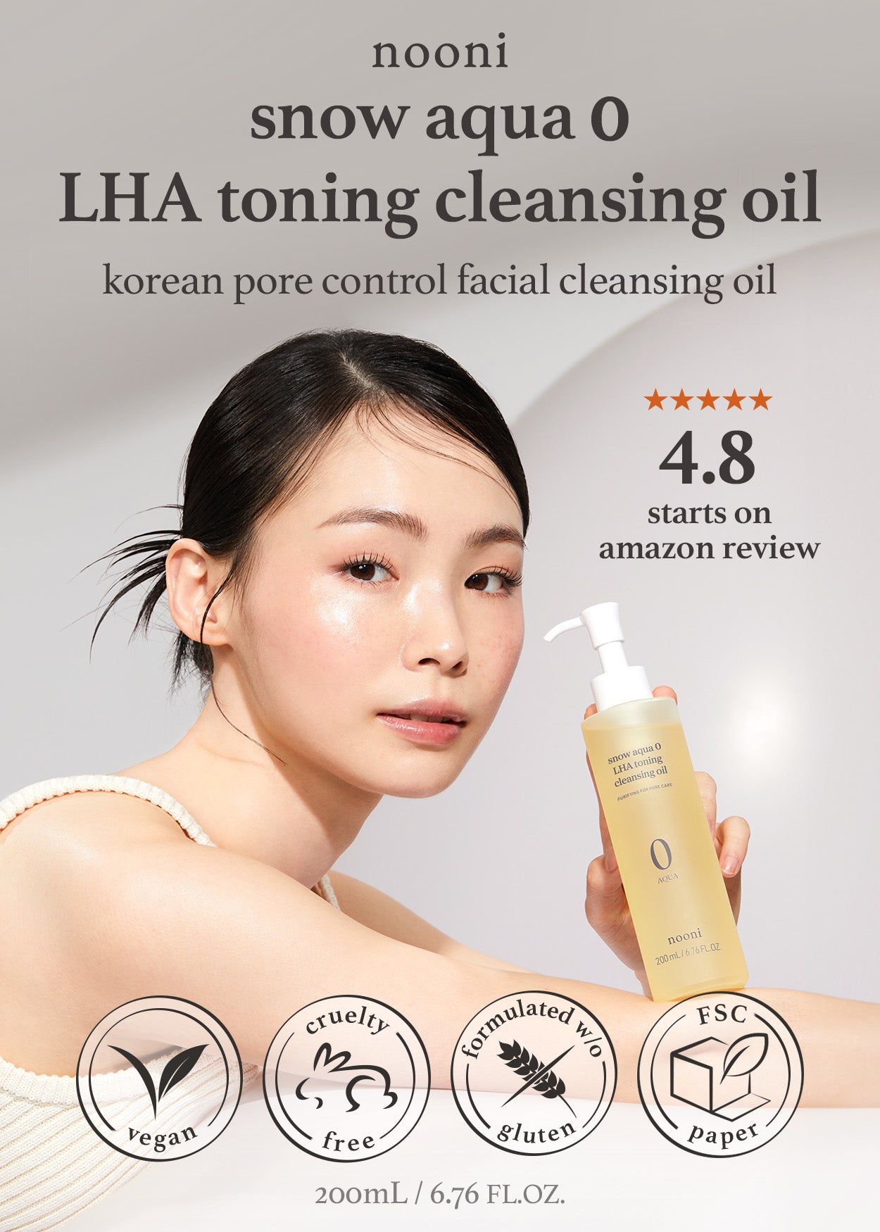 Model holding Nooni LHA Cleansing Oil, 4.8 Amazon review, vegan, and cruelty-free logos