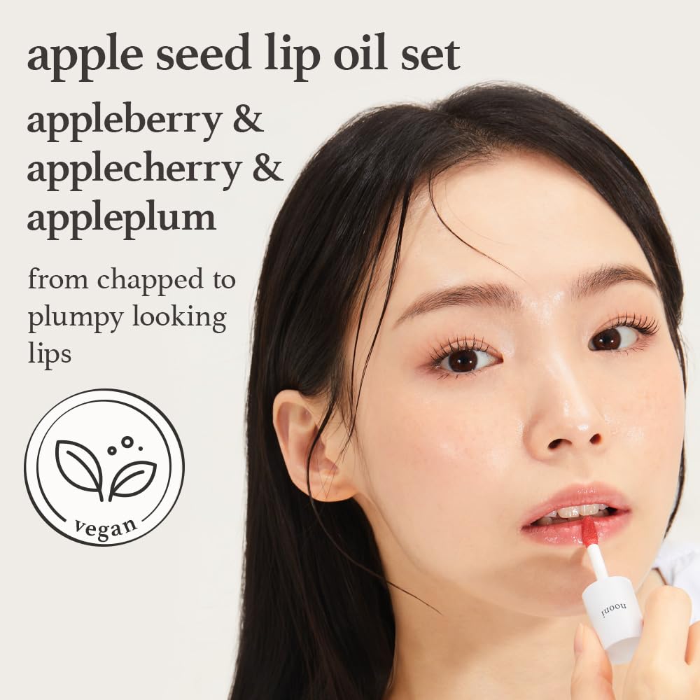 Apple seed lip oil set with appleberry, applecherry, and appleplum applied showing glossy tinted lips with vegan formula.