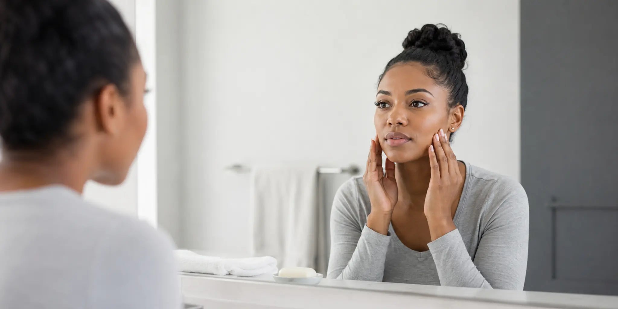 Woman preparing to wash her face while wearing eyelash extensions