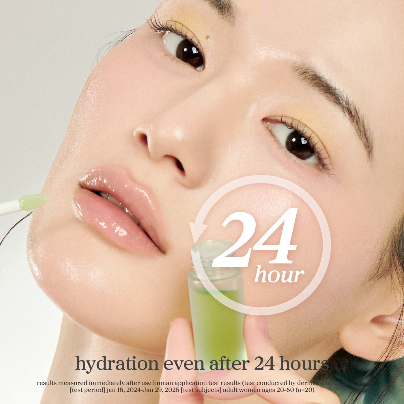Model applying nooni appletea lip oil highlighting glossy lips and hydration lasting up to 24 hours.
