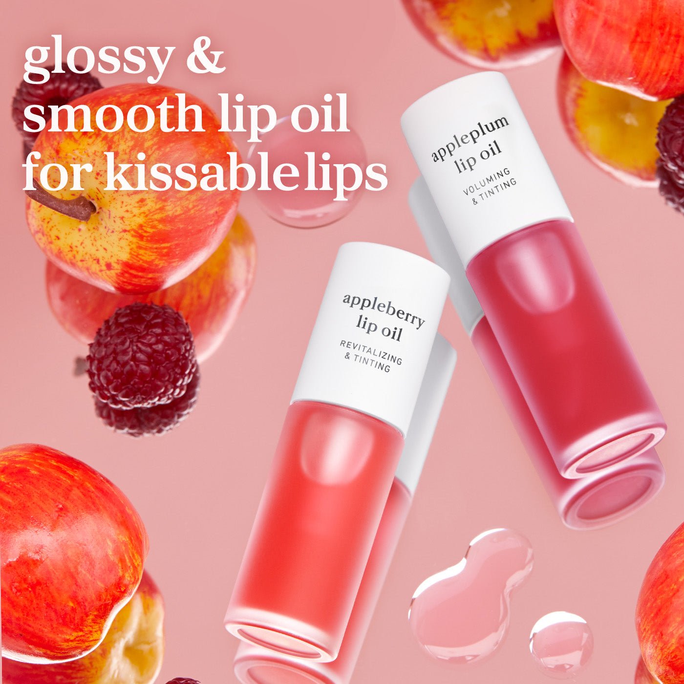 Appleberry and appleplum lip oils with fruit elements showing glossy tinted shades and smooth finish.