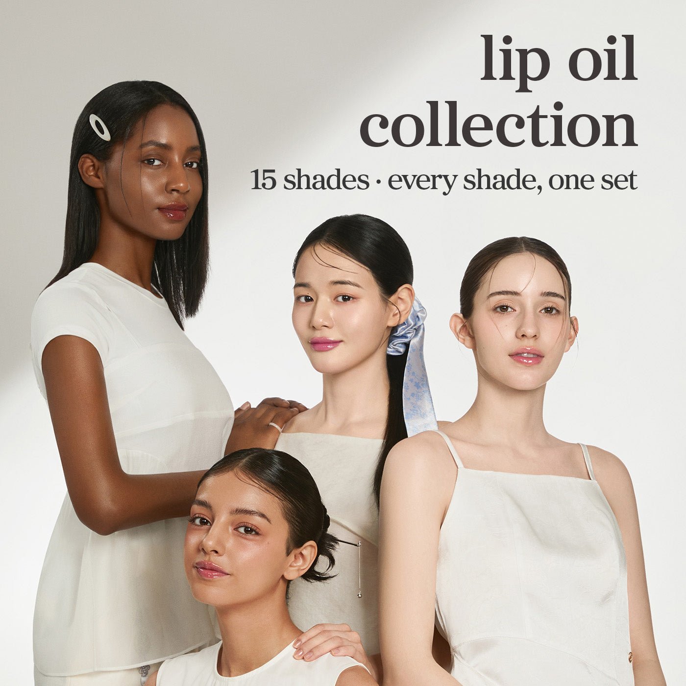 Models wearing multiple lip oil shades from nooni Complete Color Collection 15 pack.